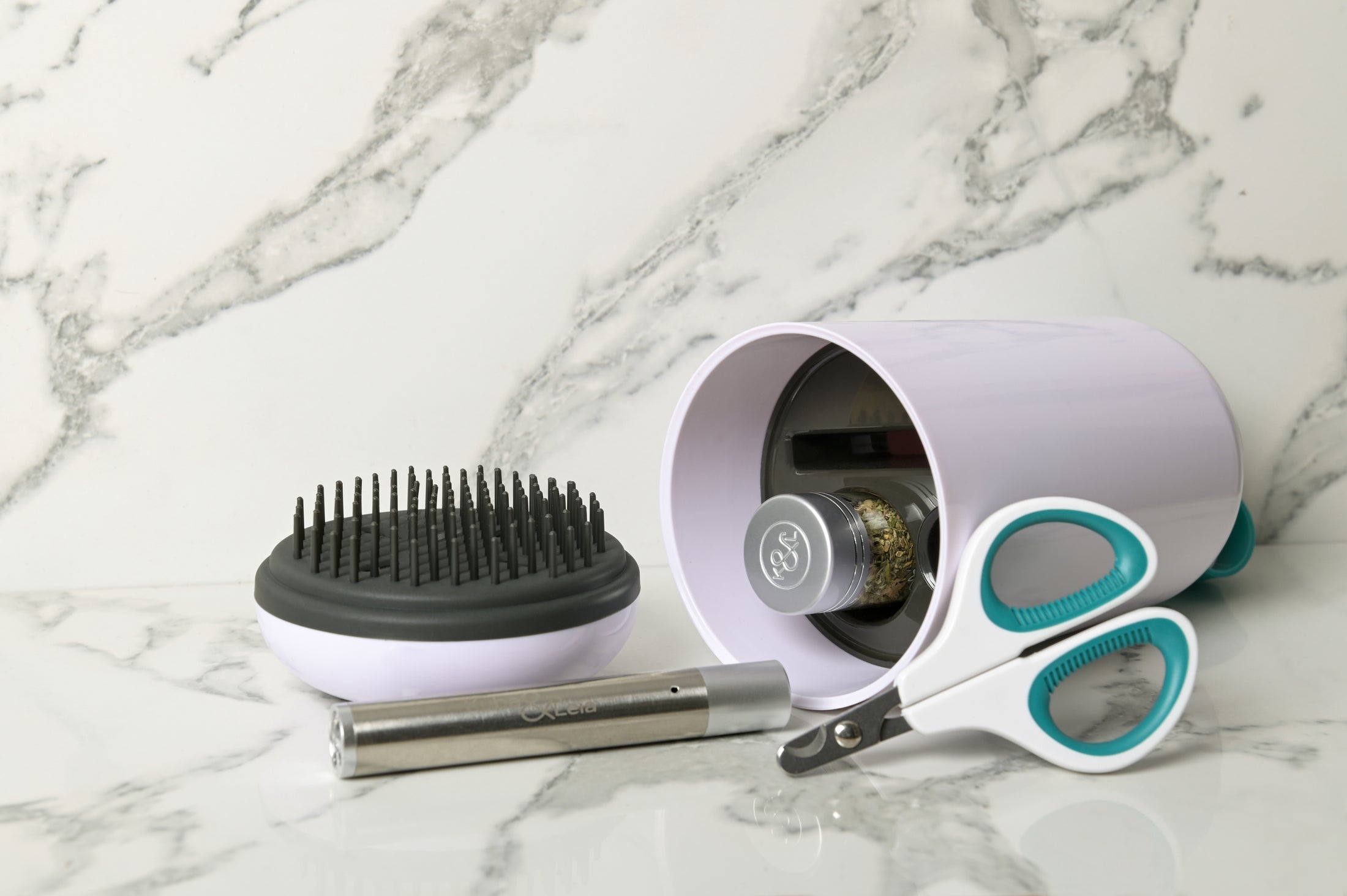 The BrushPod by Kuba & Leia. Catnip infused cat brush, catnip, laser toy and claw clippers